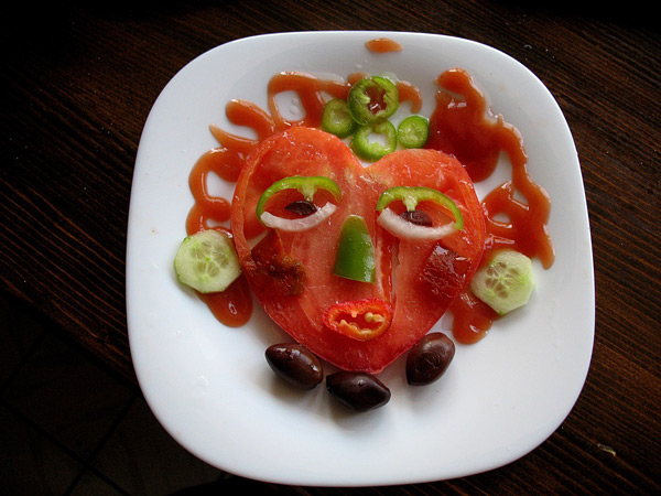 salad dressed as human face